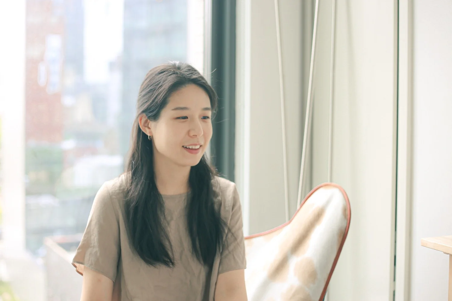 Shua Kim seated in a calm treatment room.